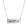 Macro view of silver bar pendant with POGUE LIFE text and Shaka gesture engraving - Silver