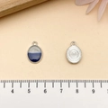 Blue and white drip oil oval pendant charm with silver metallic textured back - Blue Gold Dusted Bicolor Oval (21877)