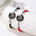 Close-up of black and red braided bracelets with colorful heart fingerprint charms - Gradient Heart Fingerprint Pattern (Style 5)