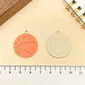 Gouden basketbal bedeltje met oranje emaille en gestructureerde achterkant voor DIY sieraden - Basketbal (21719) / 29x26mm / Oranje Emaille