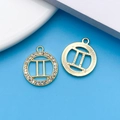 Golden Gemini zodiac charm set with sparkling cubic zirconia and engraved metal finish - KC Gold Gemini