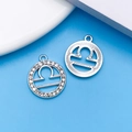 Silver Libra zodiac charm pendants with sparkling rhinestones and radial texture - Silver Libra