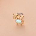 Détail d'un piercing de nez licorne dorée avec pierre irisée et tige en forme de L - 11# Style Licorne Avec Opale Multicolore / Or