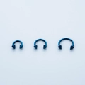 Three blue stainless steel circular barbells with spikes for nose and ear piercing - Blue