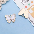 Pendentif papillon blanc en alliage avec bord doré pour la création de bijoux DIY - Blanc