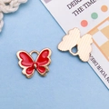 Pendentif papillon émaillé rouge avec bordure dorée pour la création de bijoux - Rouge