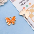 Orange enamel butterfly charm with gold metal edges for DIY jewelry and necklaces - Orange