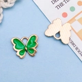 Green enamel butterfly charm in gold alloy with textured back for DIY jewelry - Green