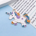 Cartoon unicorn pendant in white enamel with gold trim and purple accents - Enamel Unicorn (11445)