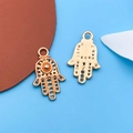 Rose gold Hamsa Hand charms with intricate hollow patterns for DIY jewelry making - Hamsa Style