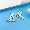 Pendentifs de skieurs argentés pour bijoux DIY, breloques de sport vintage - Skieur en Argent Antique 16x18mm