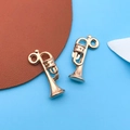 Polished gold alloy trumpet pendant charms for DIY jewelry making and bracelets - Musical Horn Style