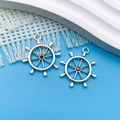 Two antique silver ship wheel nautical charms for DIY jewelry on blue background - Antique Silver Anchor (3272) / 25x28mm