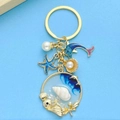 Blauer Ozean Seestern und Delfin Schlüsselanhänger mit Perle und Muschel in Gold - Öltropfen Blau Delfin Seestern Muschel Perle Stil (ER544)