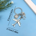 Travel keychain with airplane, globe, camera and cloud charms in silver finish - Plane Globe Camera Cloud (ER677)