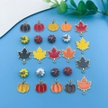 Enamel pumpkin and maple leaf charms for DIY Thanksgiving jewelry making on blue background - Enamel Maple Pumpkin Style (SN279)