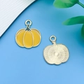 DIY jewelry charm with pumpkin shape featuring bright yellow enamel and gold metal rim - Yellow Enamel Pumpkin
