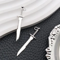 Detail view of antique silver dagger pendants with serrated blades for DIY jewelry making - Antique Silver Tool Weapon Knife Style