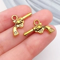 Pendentifs revolvers dorés avec détail d'étoile pour accessoires bijoux DIY - Pistolet Or Antique (19229)