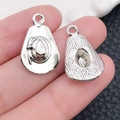 Antique silver cowboy hat pendant for DIY jewelry making shown in hand for scale - Antique Silver Cowboy Hat
