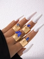 Set de cuatro anillos anchos dorados con colgantes azules de ojo y mariposa - Juego de Mariposa Azul/Ojo Turco/Gema / Set de 4 piezas / Dorado
