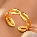 Macro detail of adjustable gold shell textured ring on luxurious silk fabric - Gold Shell (C1493)