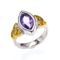 Macro view of marquise-cut purple gemstone ring with golden Celtic knot details - 7 / Two-tone Gold Silver Purple Zircon