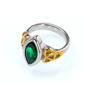 Detailed macro view of retro punk steel ring with green marquise stone and Celtic knots - 7 / Two-tone Gold Silver Green Zircon