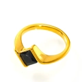 Close-up of a gold stainless steel ring featuring a square-cut black stone inlay - US 6 / Gold Black