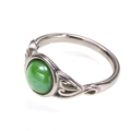 Macro view of vintage silver ring featuring green gemstone and hollow filigree patterns - Silver Green Gemstone