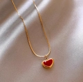 Titanium steel heart necklace with red pendant and golden chain on silk background - Single Layer Heart Necklace / Gold
