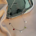 Silver butterfly necklace with colorful crystal beads on elegant champagne silk fabric - Silver