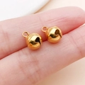 Zwei kleine vergoldete Kupferglocken für DIY-Schmuckherstellung und Handwerksprojekte - 8mm / Gold