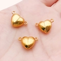 Fermoir magnétique en forme de cœur doré pour bijoux tenu dans la main pour la taille - Grand Cœur Doré