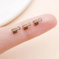 Three bronze cord end crimps for jewelry making shown on a fingertip for size scale - Small / Antique Bronze Polished Style