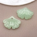 Pair of light green ginkgo leaf glass pendants for DIY jewelry making on linen background - Jelly Green