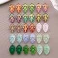 Macro detail of leaf-shaped glass beads with gold veins in various vibrant colors - 15-Style Gold Trimmed Set / 30Pcs Pack / Multicolor Mixed