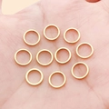 Minimalist golden geometric round rings in palm for DIY jewelry making and earrings - 8mm / Gold
