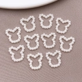 Set of 10 white pearl bear head cutout charms for DIY nail art and phone cases - Hollow Bear (12x12mm)
