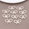 White faux pearl bowknot charms for DIY crafts and nail art on soft textured fabric - Hollow Bowknot (10x18mm)