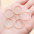 Set of five minimalist thin geometric round rings in a smooth rose gold finish - 20mm / KC Gold