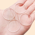 Slim rose gold copper geometric rings held by hand for DIY jewelry making - 30mm / White Gold