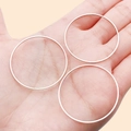 Three slim rose gold copper geometric round rings for DIY jewelry making on palm - 35mm / White Gold