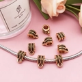 Macro detail of antique gold bail beads with striped texture for DIY bracelet making - Horizontal Stripe Style (14338)