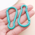 Teal aluminum gourd-shaped carabiner clips on palm for keychains and DIY crafts - Dark Green