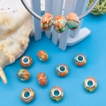 Bunte orangefarbene Glasperlen im Tintenstil für DIY-Armbänder mit silbernem Metallkern - Orange