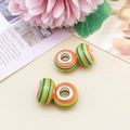 Set of four colorful resin beads with orange, green and yellow stripes for DIY jewelry making - Orange Green Striped