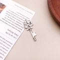 Vintage silver alloy key pendant with intricate floral engravings and antique finish - Retro Carved Key (6699)