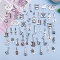 Antique silver musical instrument alloy charm set featuring guitar and violin motifs - Mixed Music Instruments
