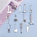 Set of vintage silver alloy tool pendants including axe and saw for DIY jewelry making - 13 Piece Tool Mix Set (SN79)